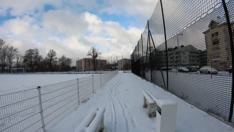 hyper-lapse shot of a snowy sporting facility in a city suburb