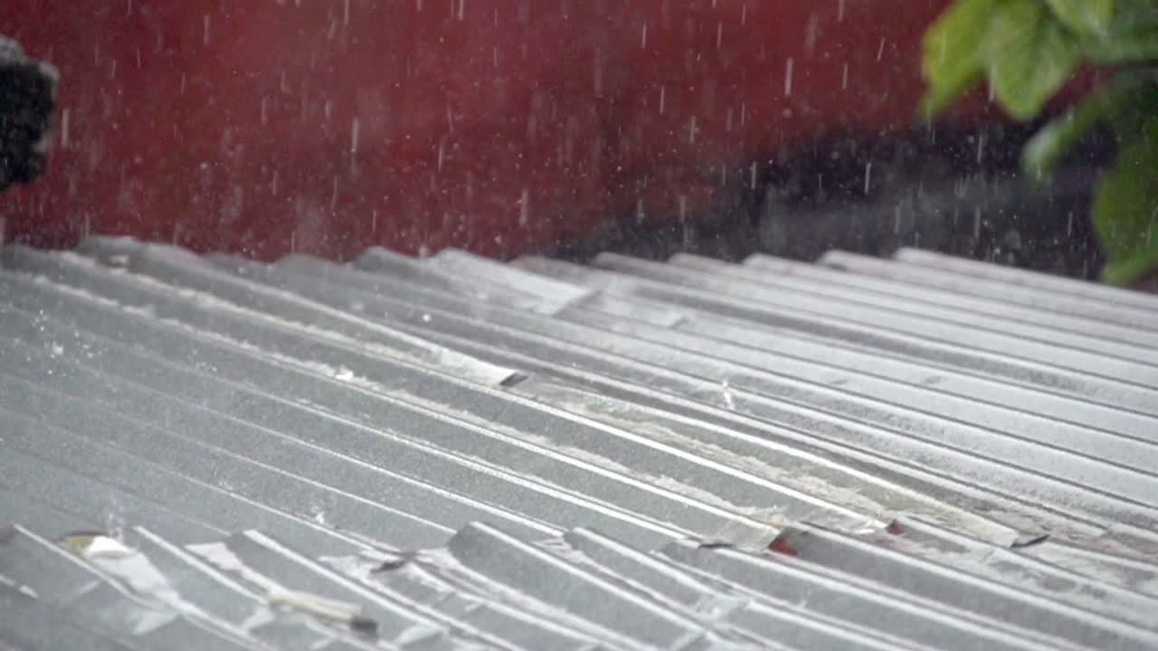 Heavy rain on a corrugated steel roof