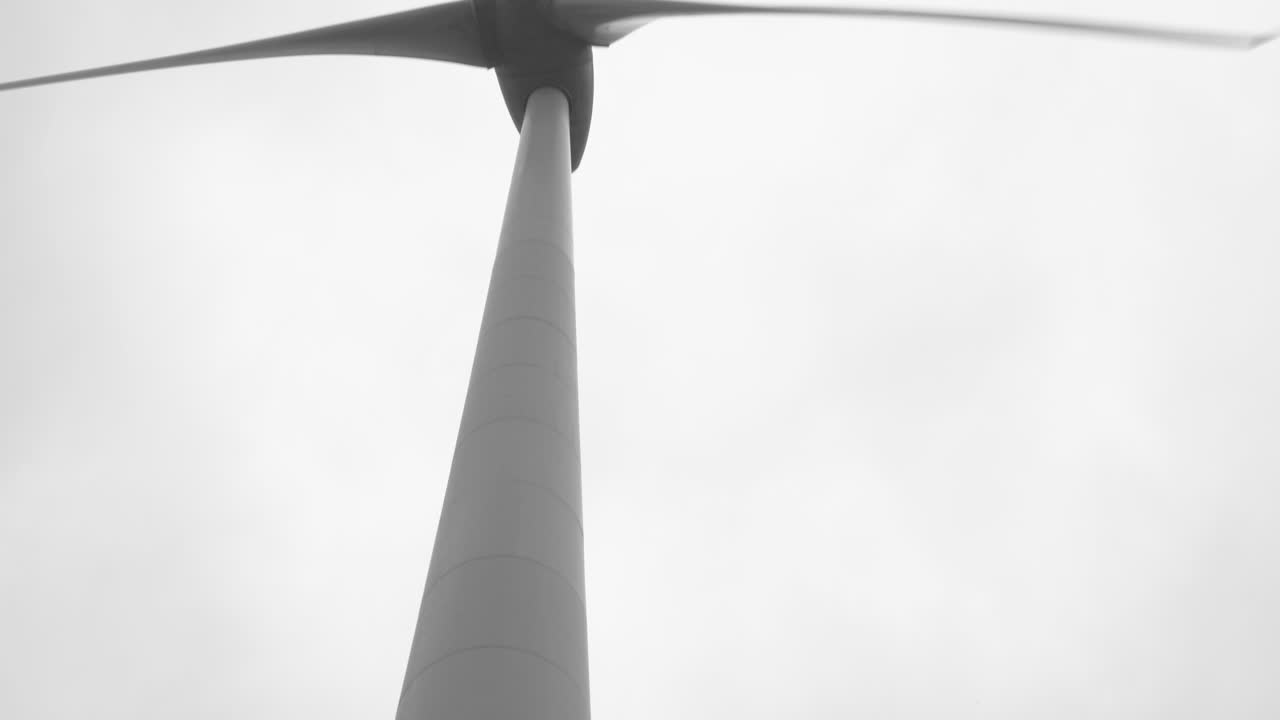 wind turbines generate energy on a cold windy day