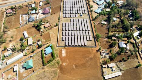 jib down of solar panel farm in rural africa- sdg green renewal energy- solar panel cell photovoltaic farm