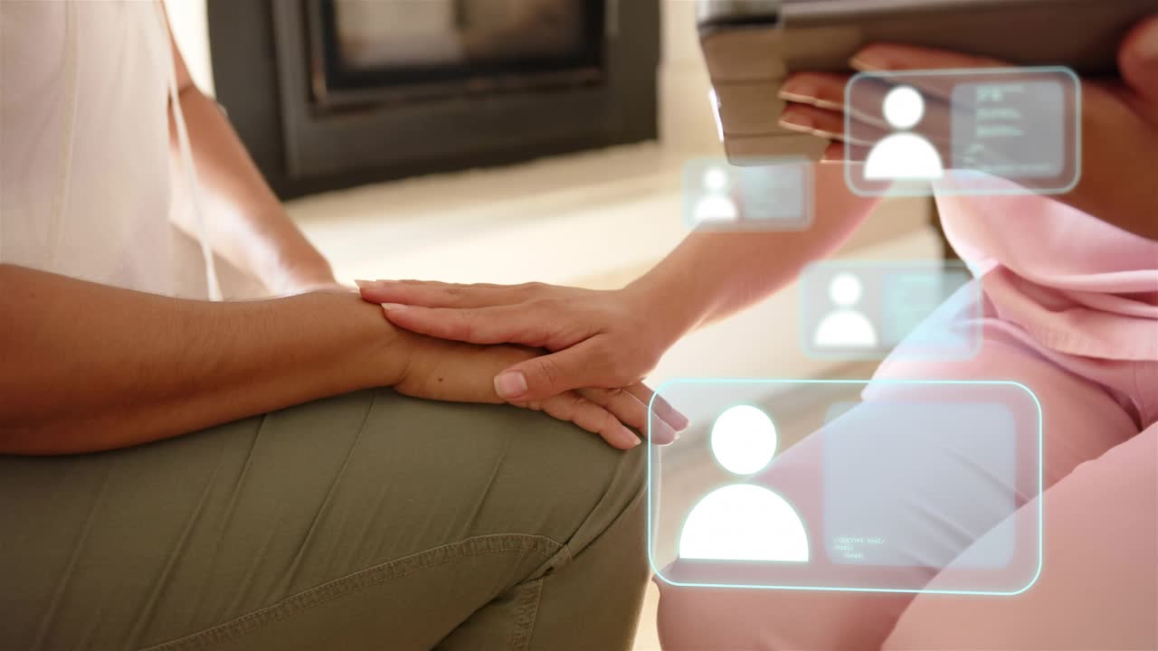 Health clinician activating holo UI from tablet over hands, placing hand on patient for comfort