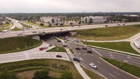 Aerial-View-Of-Traffic-Driving-At-First-Diverging-Diamond-In-Michigan,-United-States