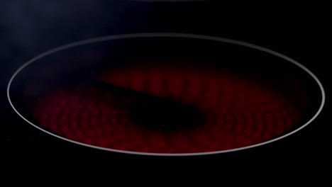 A-shot-of-an-electric-hob-or-stove-heating-up-and-turning-red