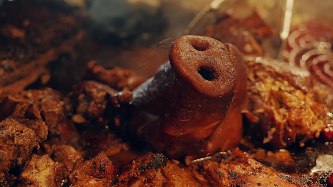 Steaming roasted pork showcases authentic Christmas market cuisine and tradition.