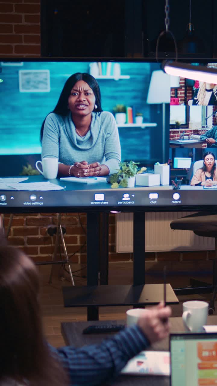 Vertical video: Employees and remote team company revenue discussion in videconference