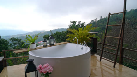 outdoor bath tub with beautiful mountain hill view background