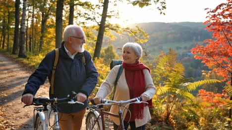 elderly couple enjoying a bike ride in an autumn forest