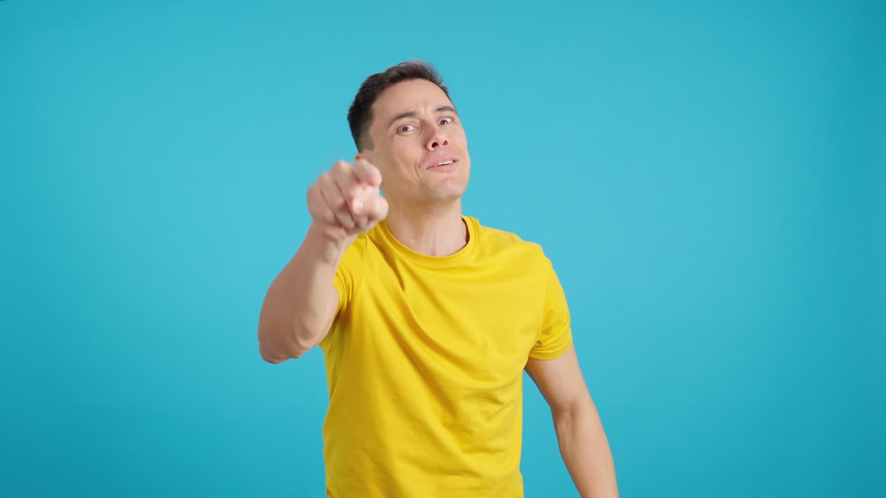 Man in yellow shirt expressing doubt and suspicion
