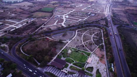 oxygen bird park with outer ring road at jamtha, nagpur, maharashtra, india. sun set time, circle shot, drone shot, 4k.