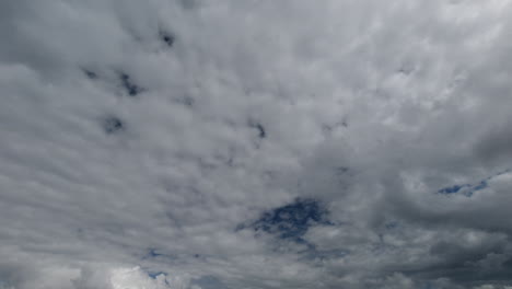 Stormy-rain-clouds-passing-by-Spring-sky,-long-shot-time-lapse