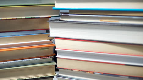 pile of colorful used books forming towers