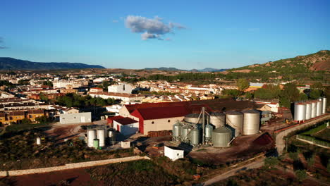 aerial circling a wine fermentery in els purgatés, alicante, spain