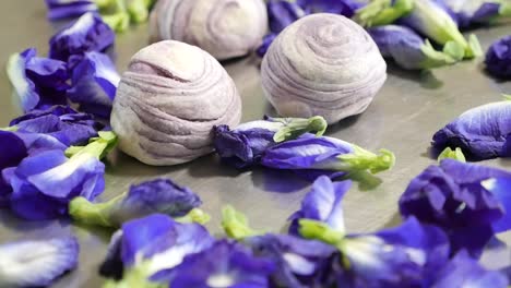 purple chinese pastry with butterfly pea flower, close up