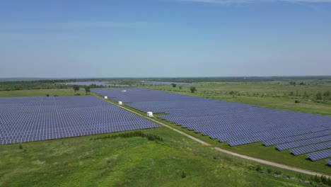 solar farm with photovoltaic panels - aerial drone shot