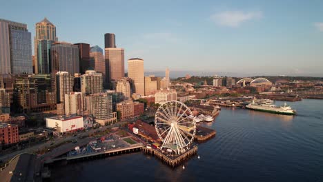 seattle waterfront, long aerial shot. great wheel and pike's place market at sunset. 4k
