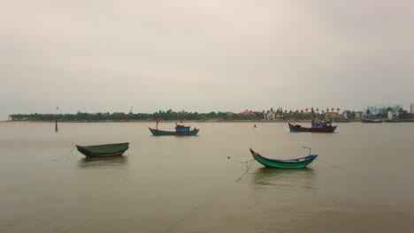 vietnam fishing boats in a river, tripod shot