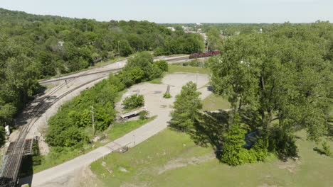 fields and green trees in lee creek park, van buren, ar, usa - aerial drone shot