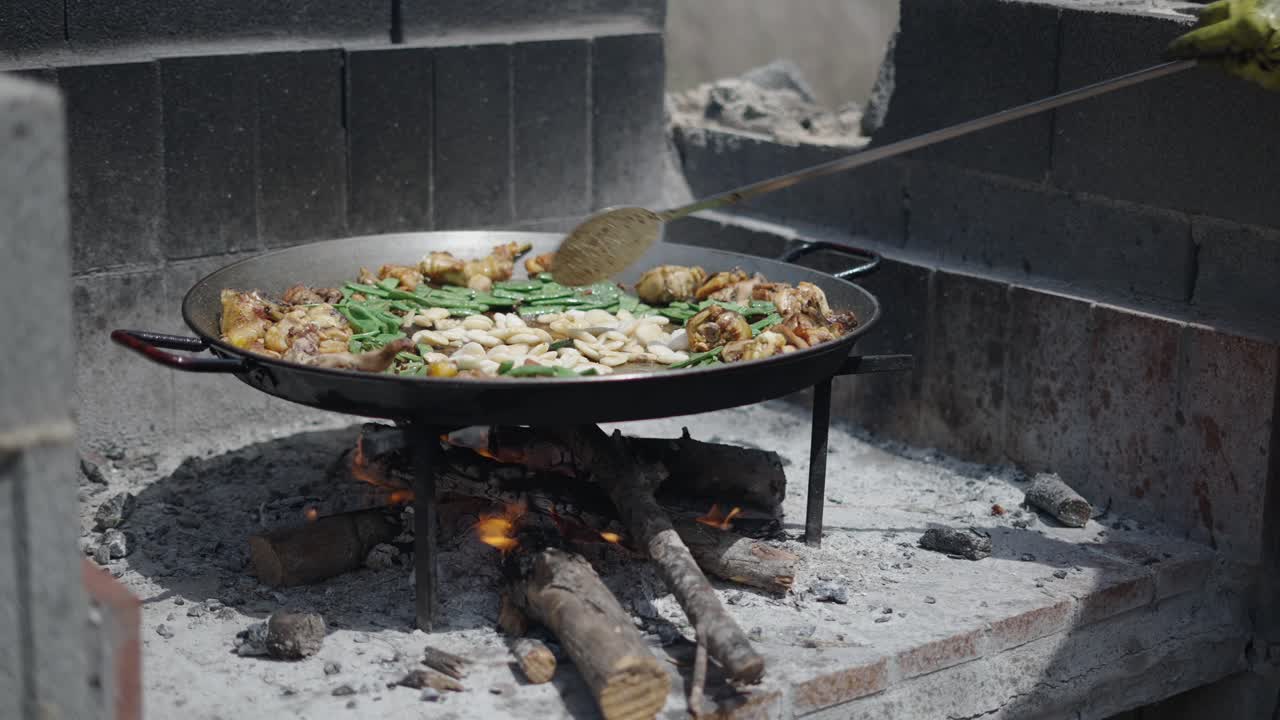 Cooking Paella Over an Open Fire