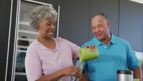 Happy-senior-diverse-people-cooking-in-kitchen-at-retirement-home