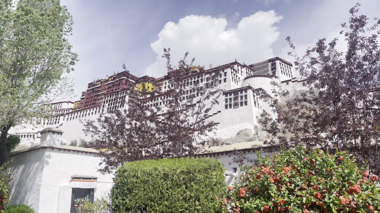 Potala Palace in Tibet Autonomous Region of China, Tibetan sovereign, the Dalai Lama, in the dzong-style, in Lhasa front view with garden blooming