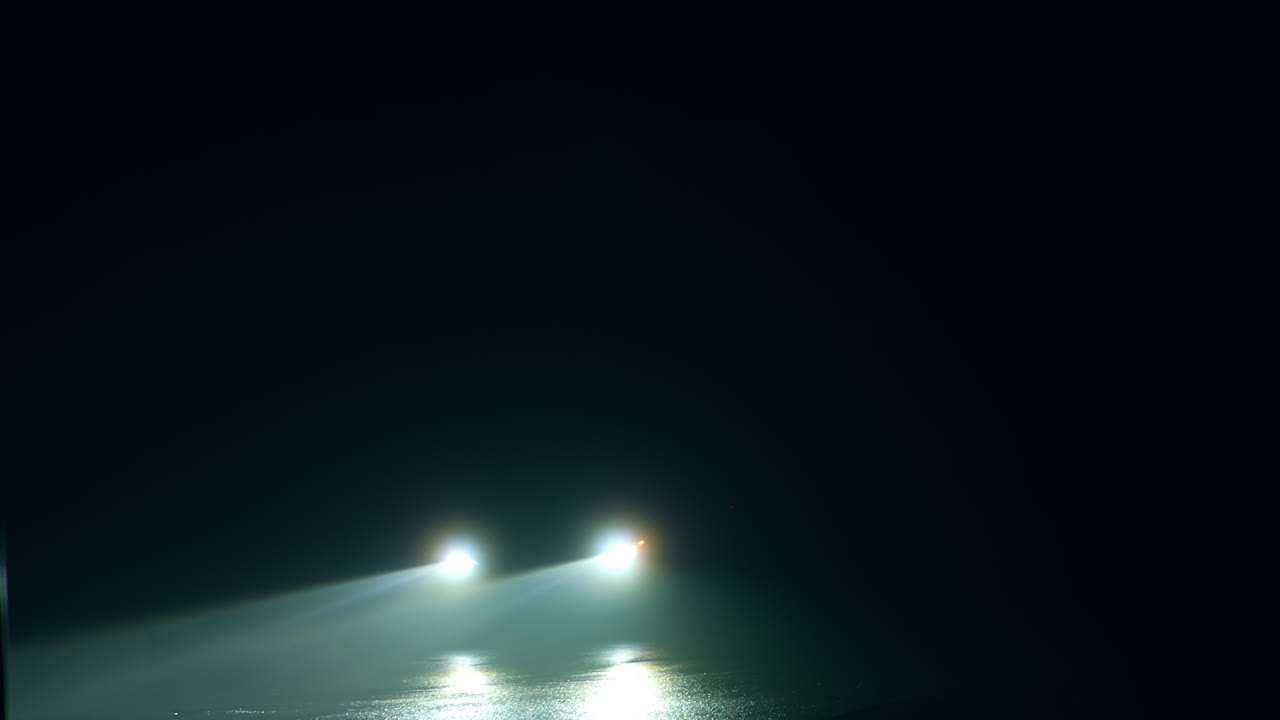 Night Drive with Headlights Reflections