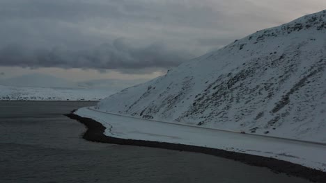 a car driving in a winter landscape during the winter