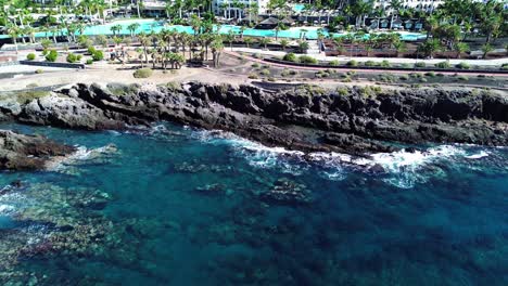 rocky coast formation, wonderful crystal clear sea water off the coast of tenerife, canary islands, spain