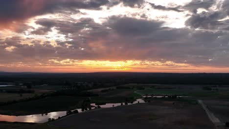 drone track over river at sunset
