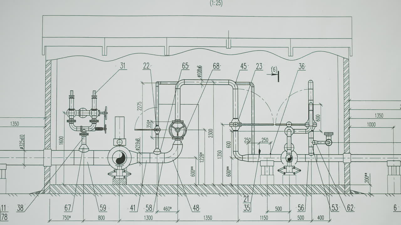 Hand pointing at an engineering blueprint