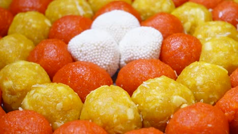 assorted colorful indian ladoo