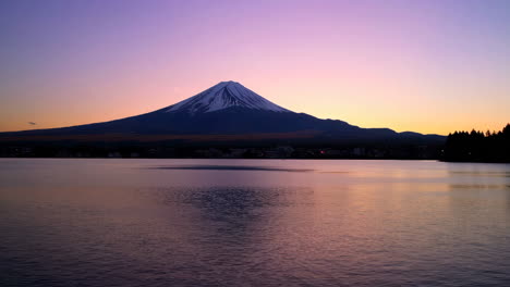 mount fuji at sunrise/sunset over lake