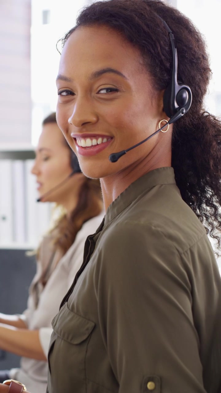 Friendly Customer Service Representative Working in a Modern Office