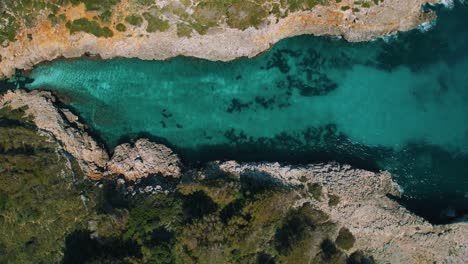 Remote-natural-bay-with-clear-turquoise-blue-sea-water-and-white-sand-beach,-Palma-de-Mallorca-Island