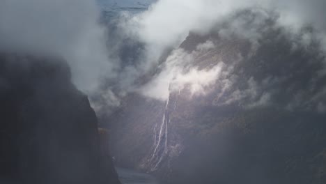 white clouds whirling above the geiranger fjord