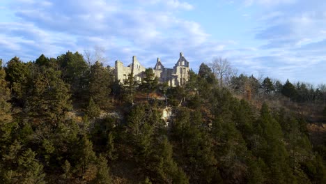 Aerial-Reveal-of-Majestic-Medieval-Castle-Ruins,-Famous-Missouri-Landmark