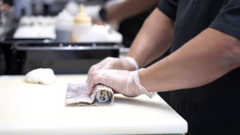 chefs preparing delicious sushi in the kitchen