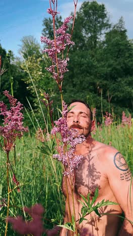 man in a field of flowers