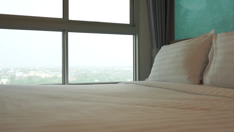 Hotel-bed-with-white,-fresh-linen