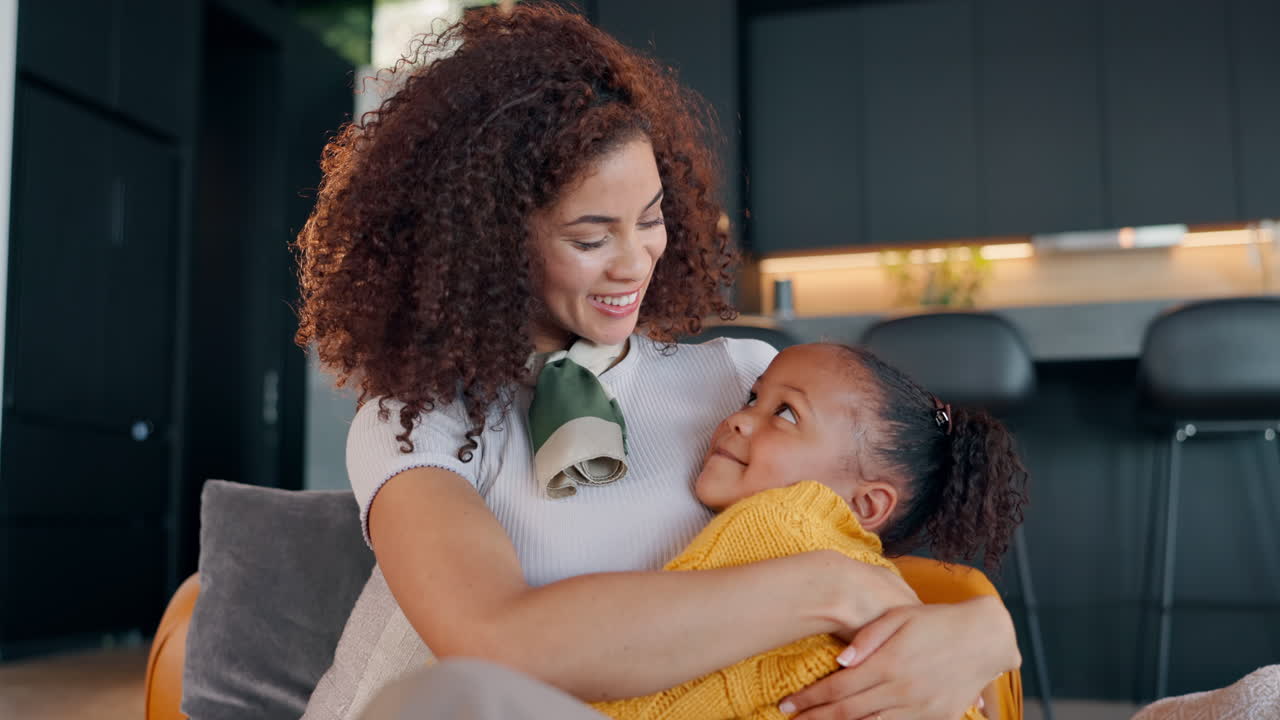 A mother and daughter share a loving embrace at home