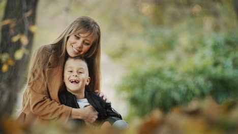 Portrait-of-a-successful-young-mother-with-her-son-looking-at-the-camera