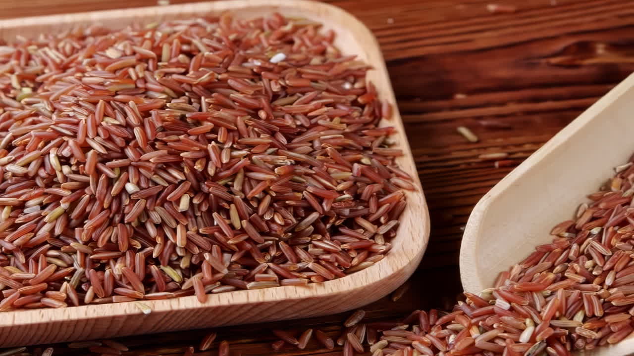 A variety of different colored Raw healthy grain food, Various grains, cereals, beans, legumes are rotated in wooden decoration for advertisement concept