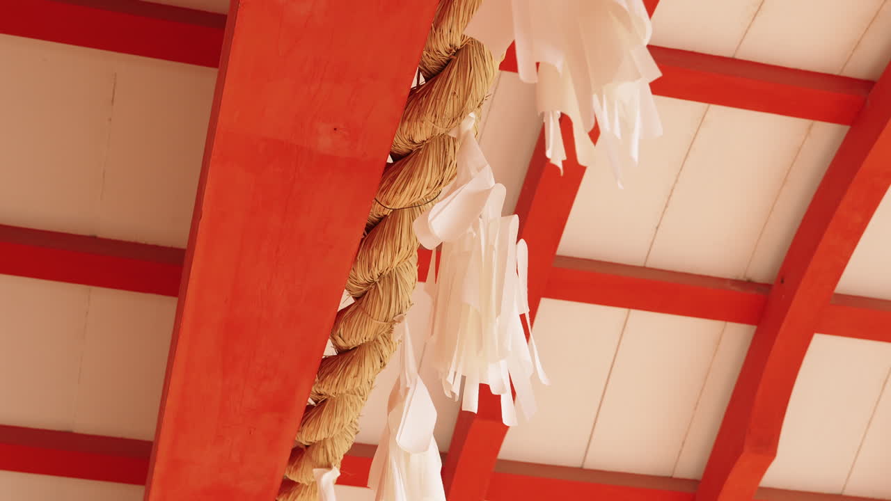 Traditional Japanese shrine details with rope and white paper streamers