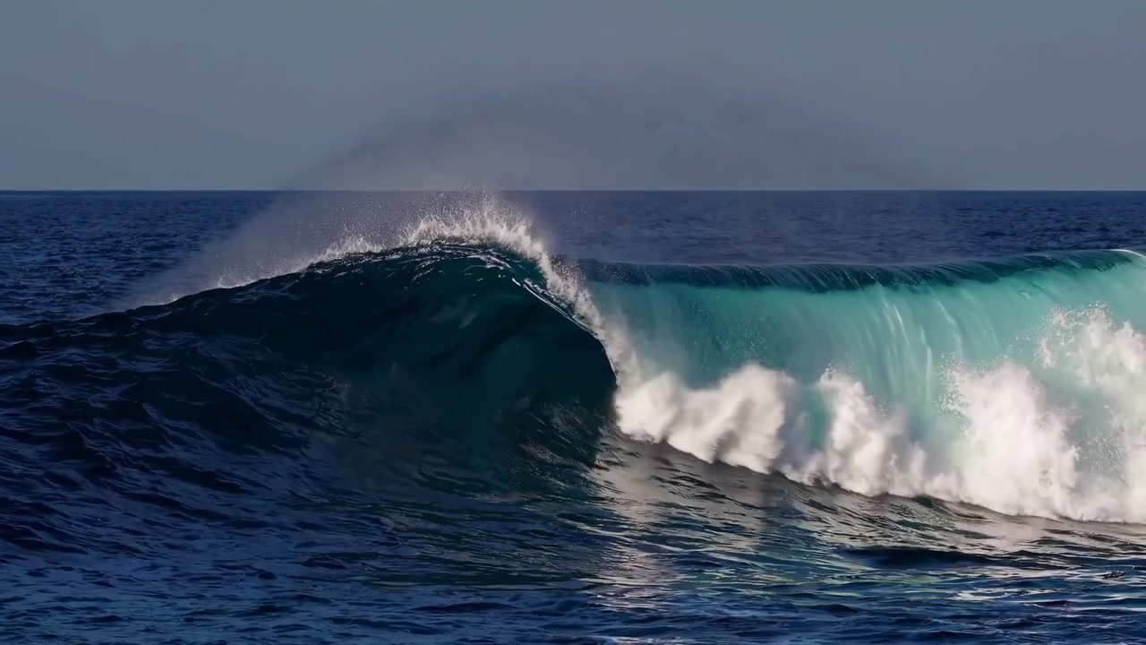 Powerful Ocean Wave Crashing and Breaking in Deep Blue Water