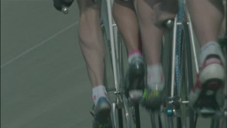 bicyclists racing on a circuit track