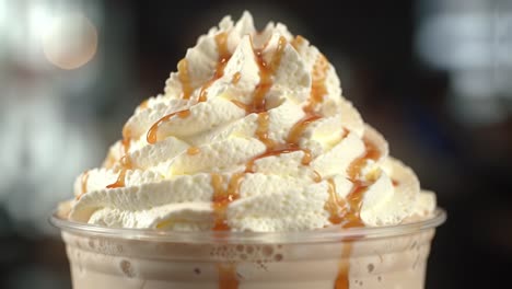 indulge in the creamy delight of a decadent dessert topped with whipped cream and drizzled with rich caramel sauce for ultimate flavor satisfaction