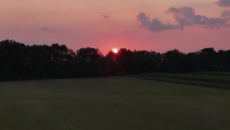 sunset over farm land in alabama