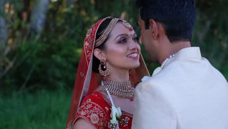 indian newlyweds look in each other eyes - wedding ceremony photoshoot