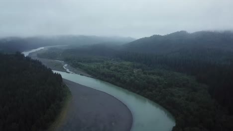 Drone-Shot-Emerald-River-California-Fog-With-Pan