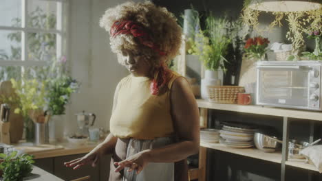 woman prepares fresh vegetables in a bright kitchen