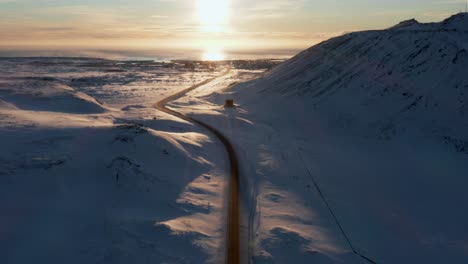 grindavíkurvegur road leading towards coast with bright sunset in iceland